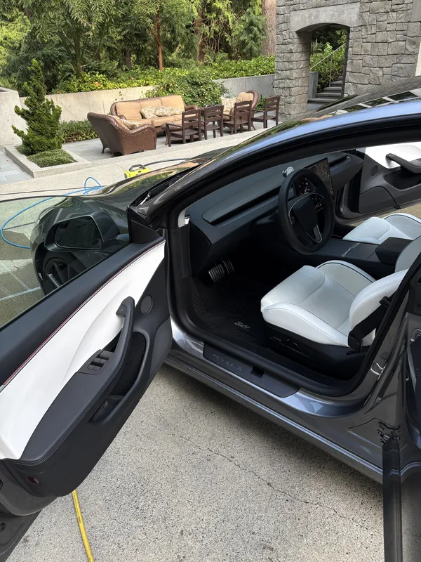 Tesla with white seats after an interior detail