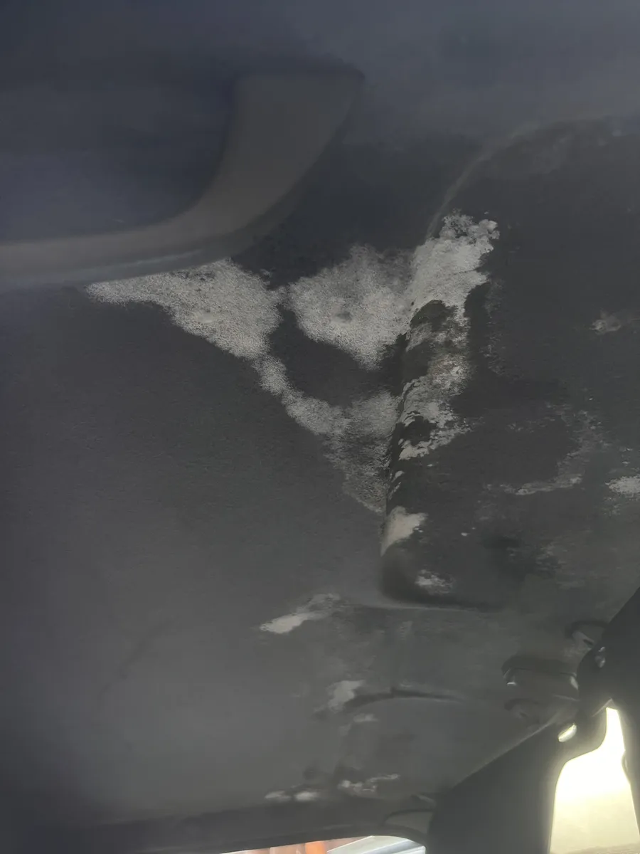 Pickup headliner with white stains before the detail