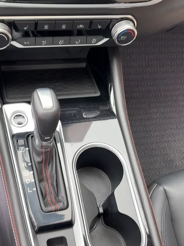 Same Nissan Altima center console and floor mats after the detail