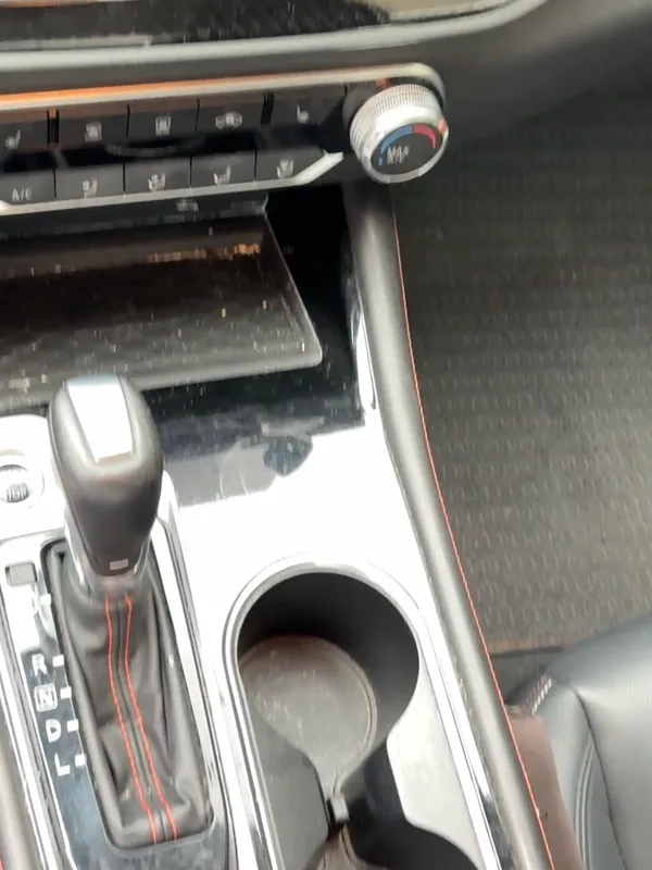 Nissan Altima center console and floor mats before the detail